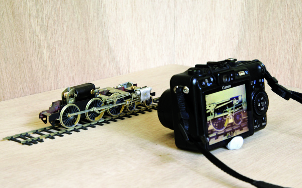 Camera
											 posed to photograph P4 chassis model